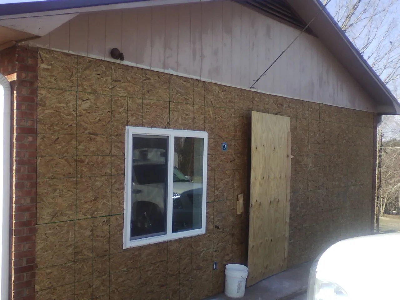 OSB sheathing on a garage addition wall before siding in Lebanon